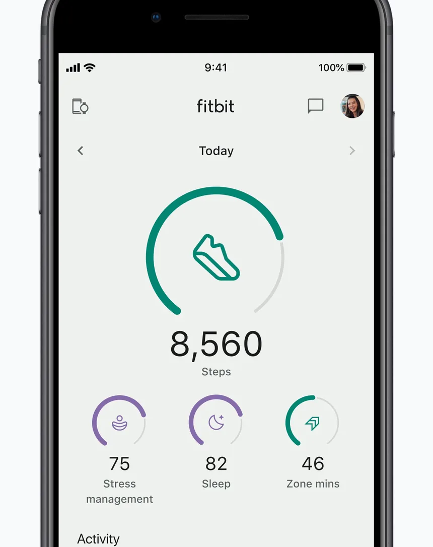 Fitbit app Today screen showing 8,560 steps with stress management, sleep and Zone Minutes rings
