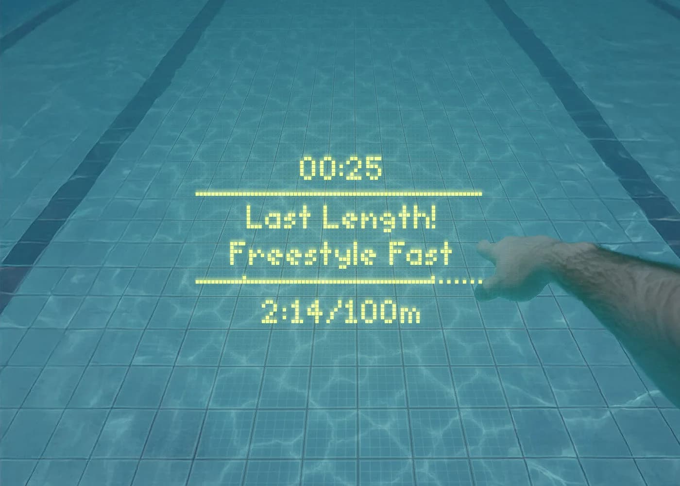 View through FORM goggles showing a last-length prompt, time and pace of 2:14 per 100 m over a pool lane
