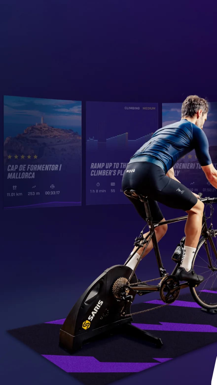 Cyclist on a smart trainer in front of a screen showing a ROUVY real-route ride